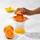 Presse citron et orange avec récipient doseur